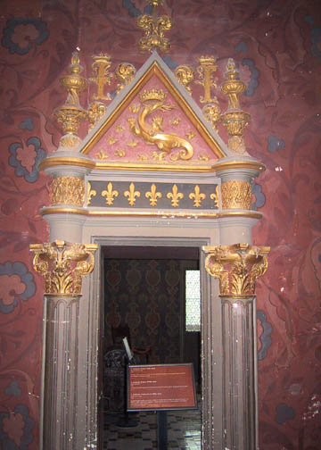 A door frame in the Queen's Gallery displaying Francis I's Salamander