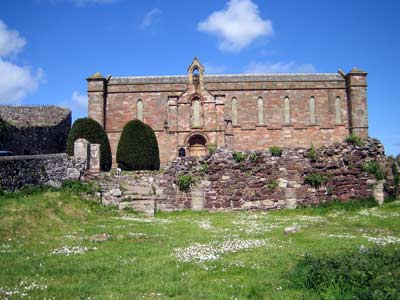 South facade of the 19th century parish church among the ruins of Coldingham Priory