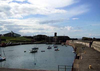 Dunbar's picturesque fishing harbour with the castle at one end